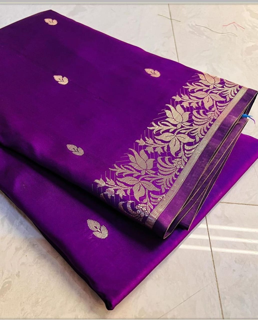 Black handwoven banarasi silk saree with copper zari border and pallu comes with small buti all over saree