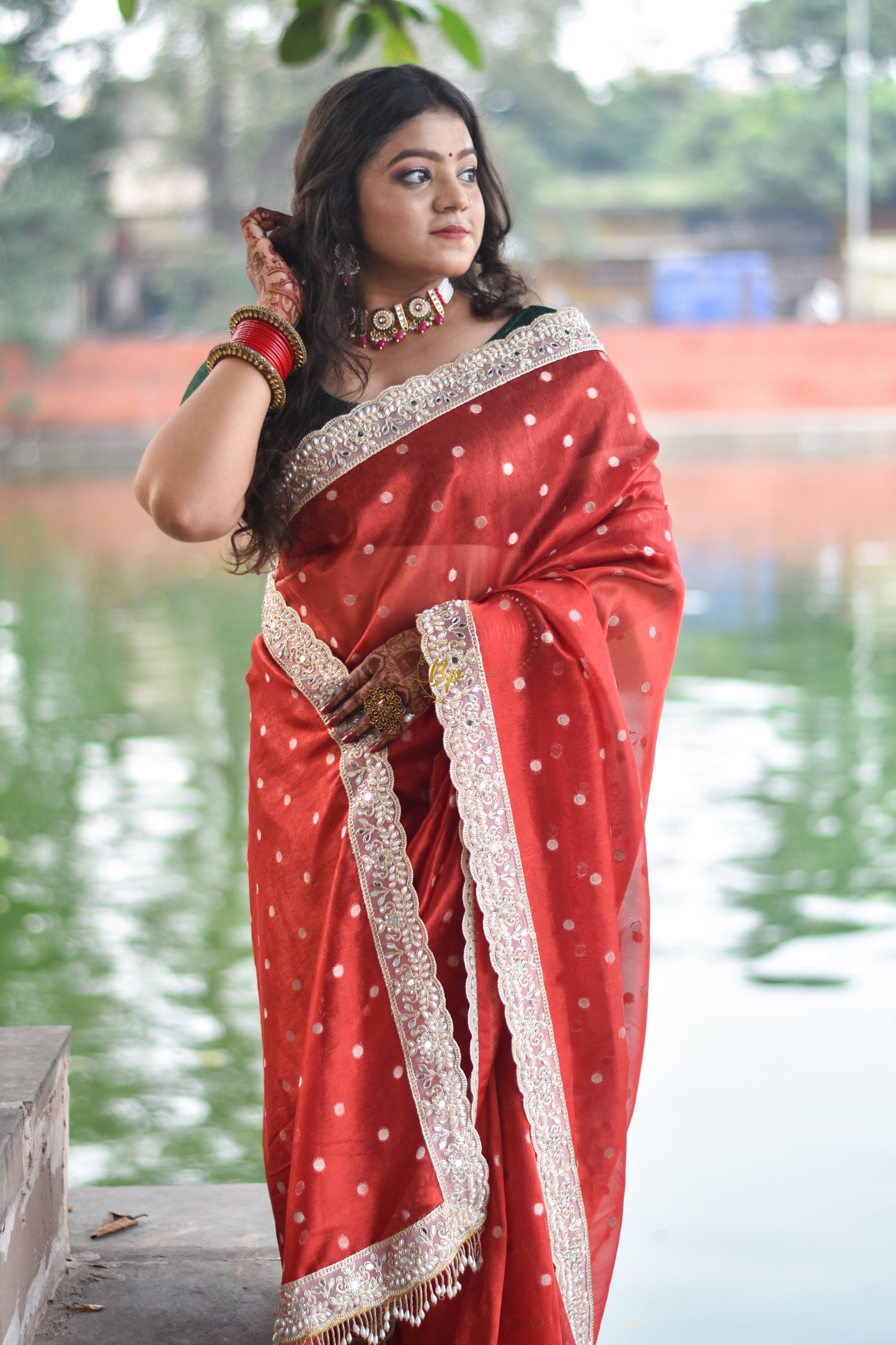 Red banarasi handwoven tissue silk saree with small zari weaving all over saree comes with beautiful pearl lace border