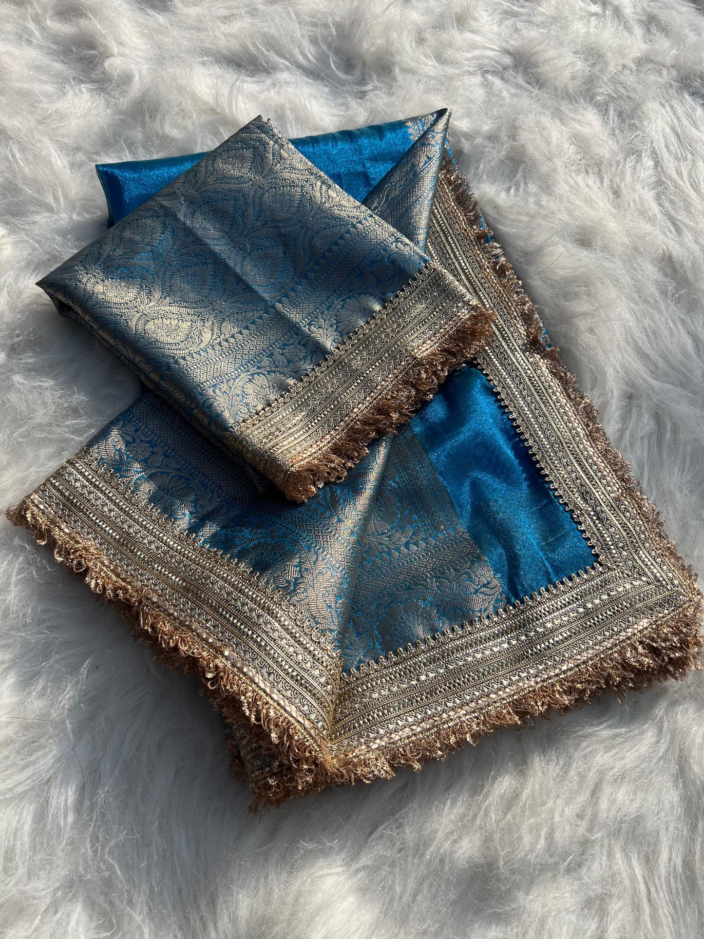 Banarasi handwoven peacock blue plane tissue silk saree with gota patti work