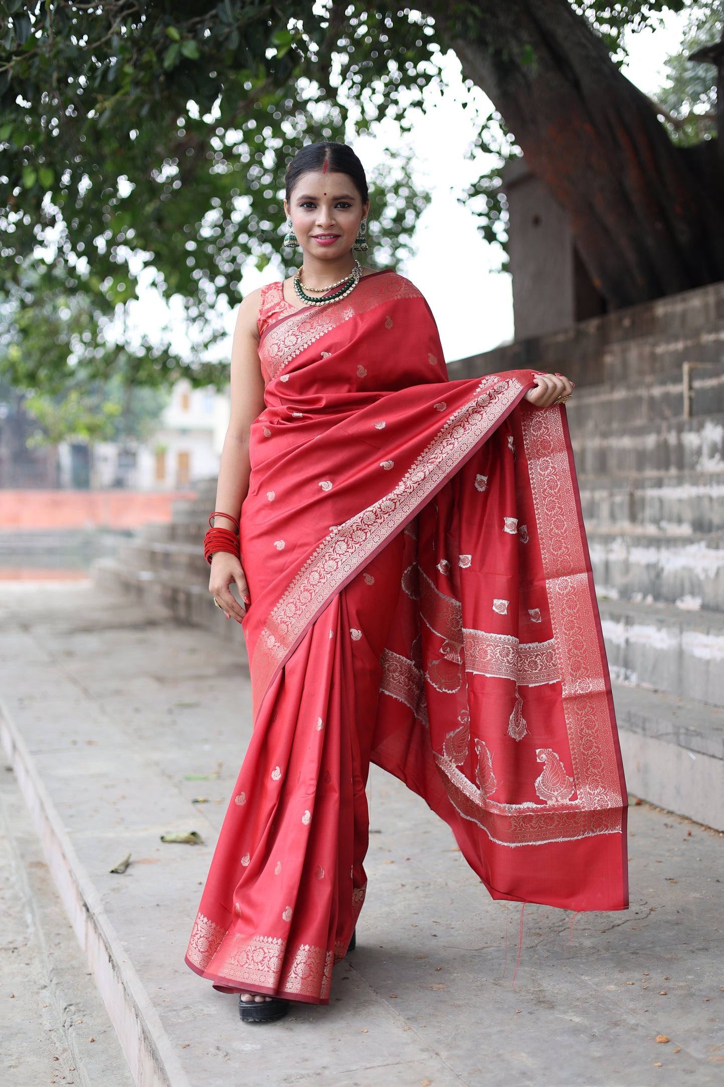 Beautiful red colour handwoven banarasi silk saree with small golden zari buti weaving.