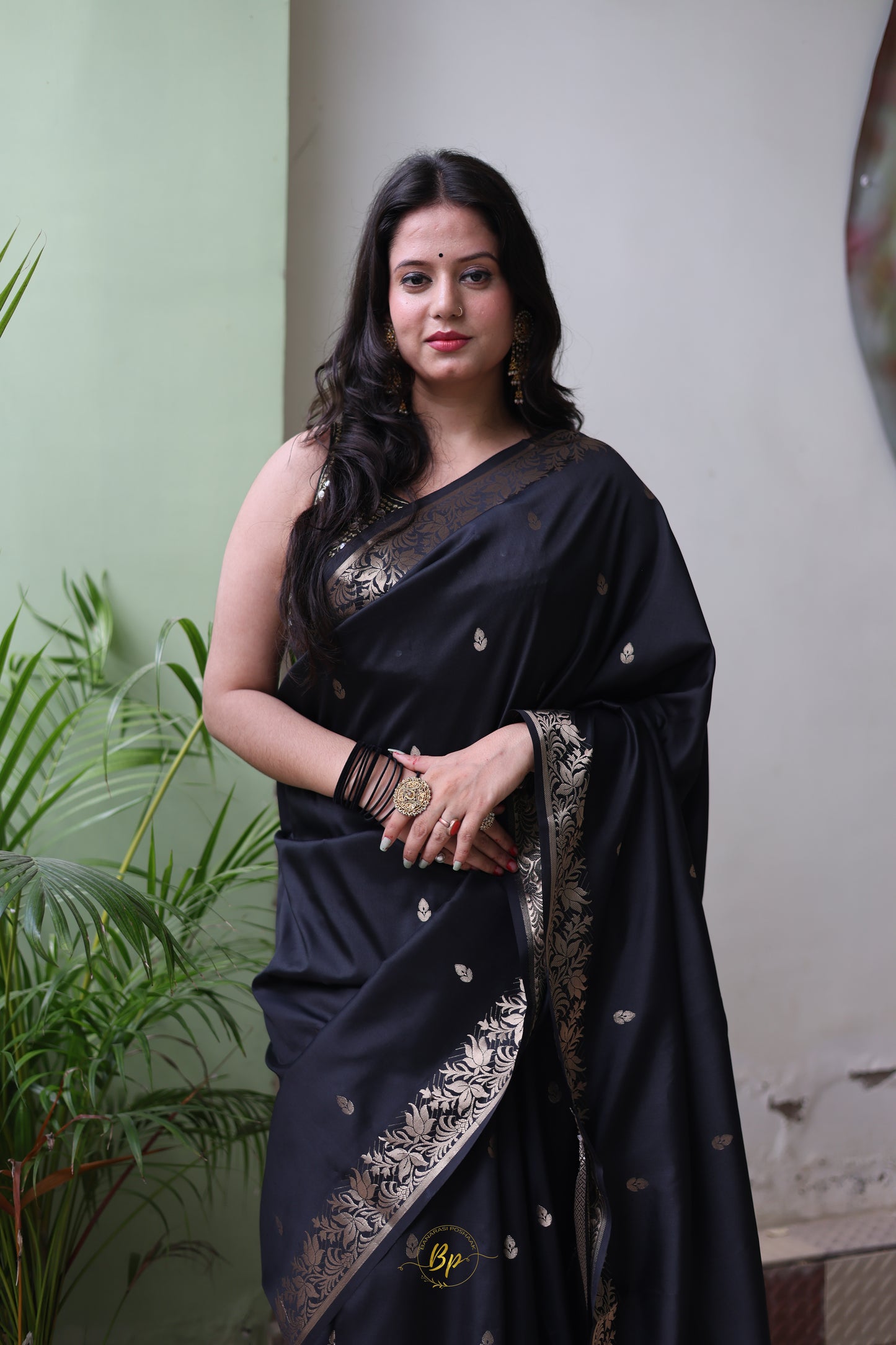 Black handwoven banarasi silk saree with copper zari border and pallu comes with small buti all over saree