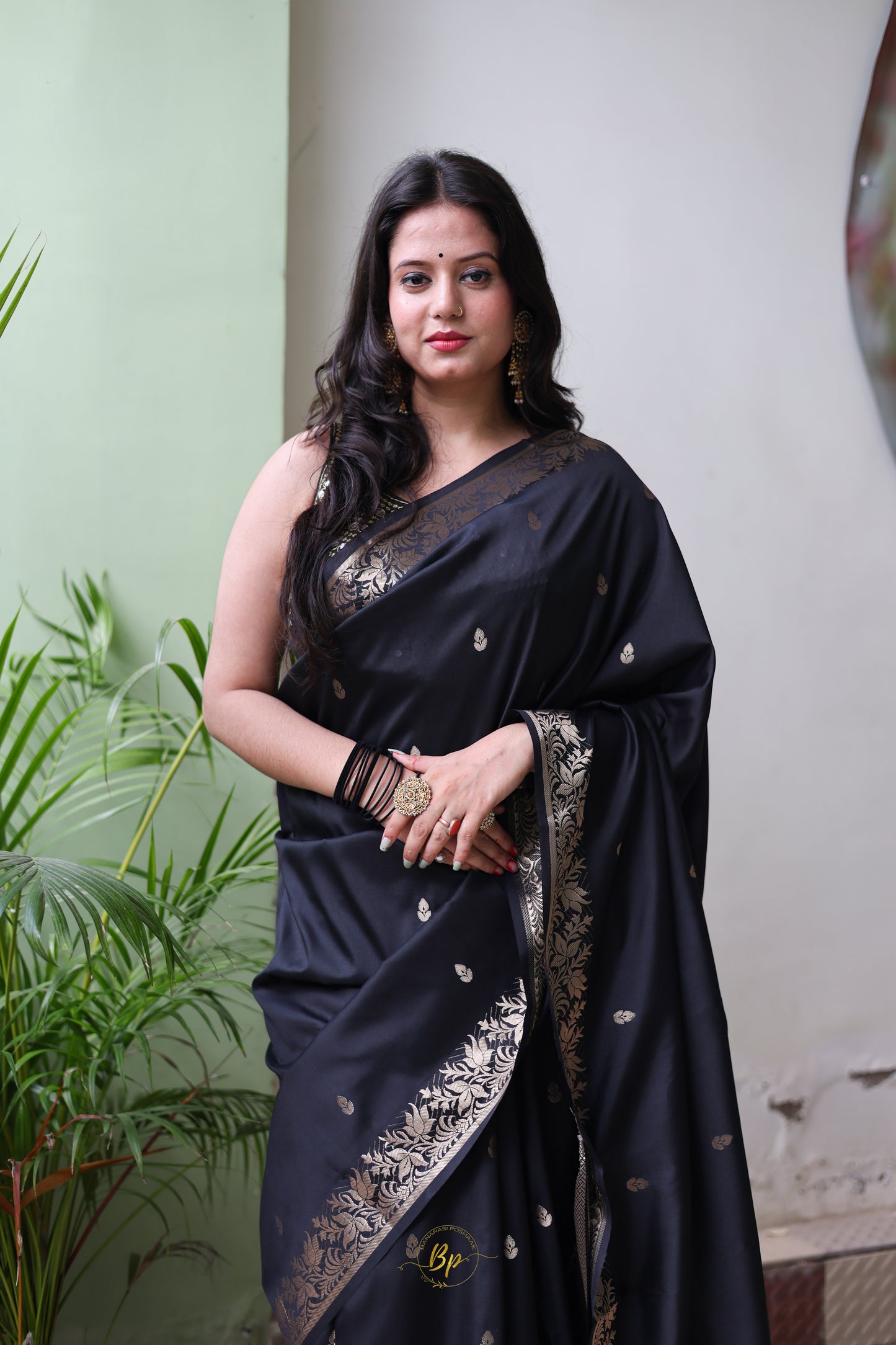 Black handwoven banarasi silk saree with copper zari border and pallu comes with small buti all over saree