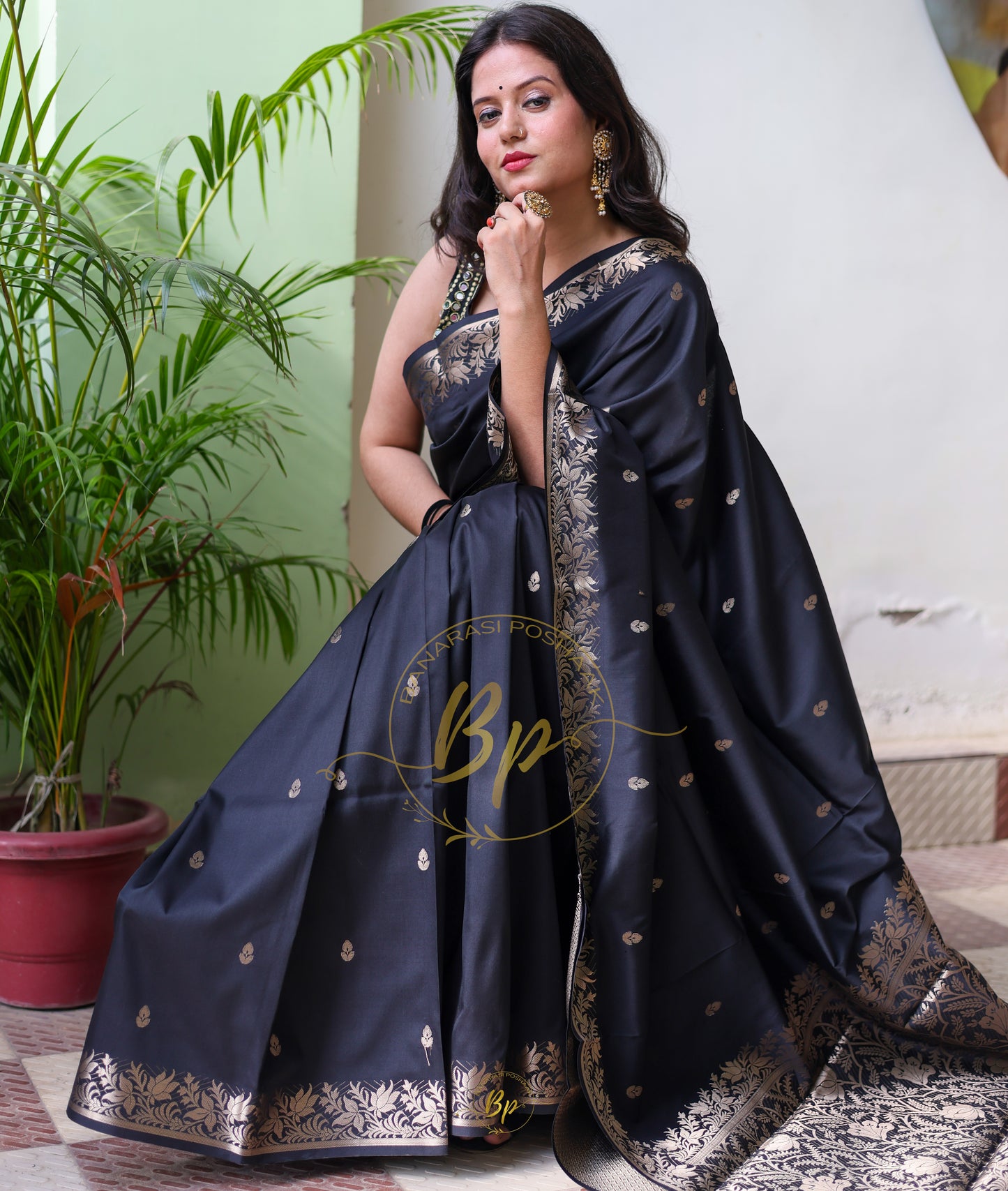 Black handwoven banarasi silk saree with copper zari border and pallu comes with small buti all over saree