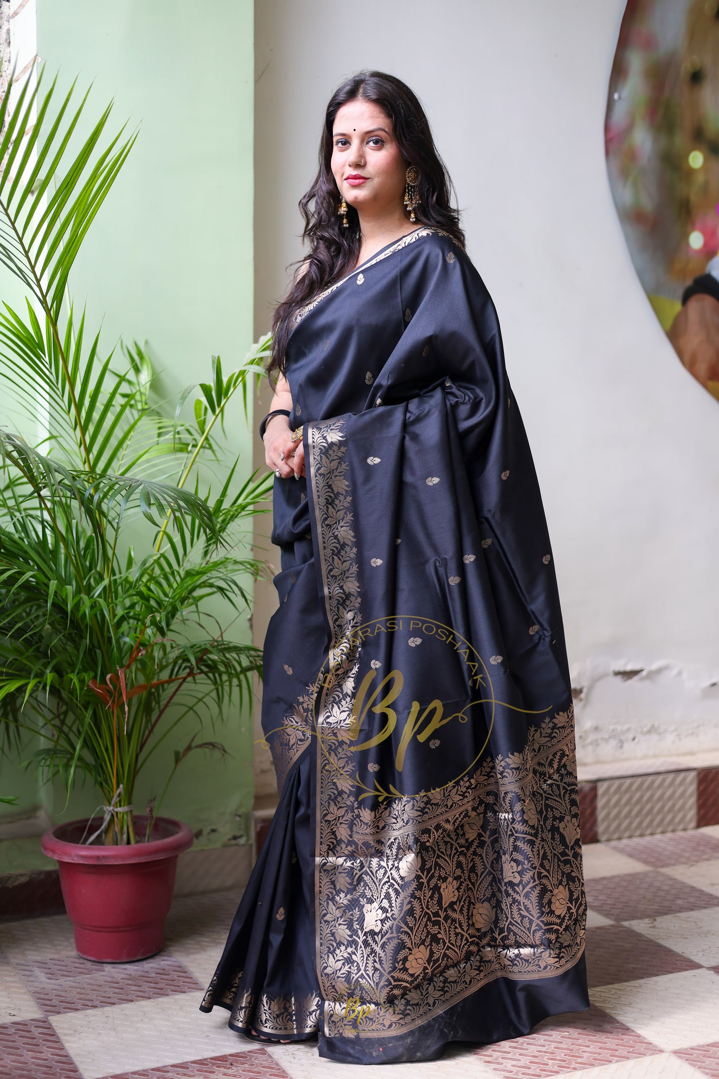Black handwoven banarasi silk saree with copper zari border and pallu comes with small buti all over saree