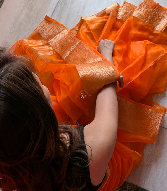 Orange handwoven banarasi organa saree with golden zari weaving