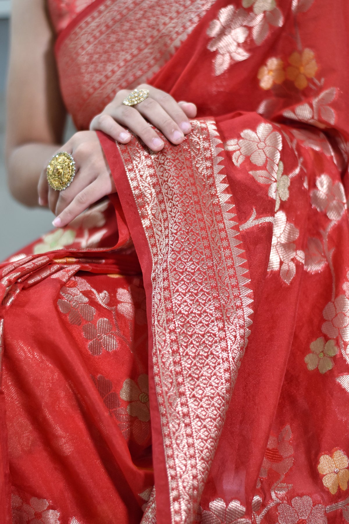 Banarasi semi chiffon saree with floral zari weaving and intricate details on border and pallu - red