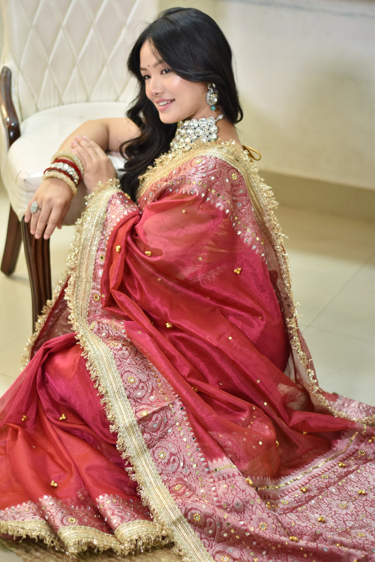Banarasi Handwoven Tissue Saree With beautiful hand mirror work and pearl and  Embroidered Ghungroo Work - Rust red