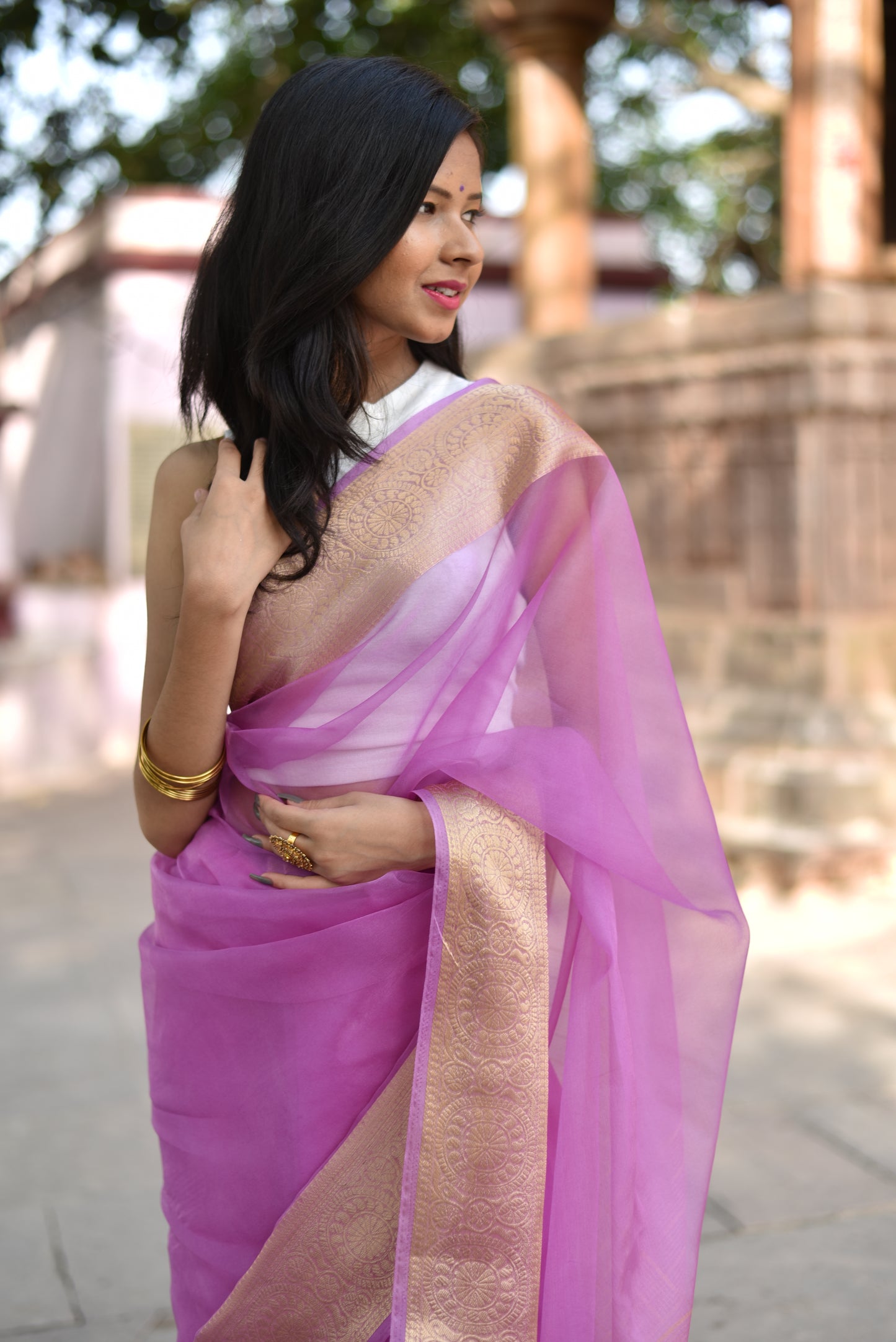 Beautiful banarasi organza saree in lavender shade comes with golden border and pallu