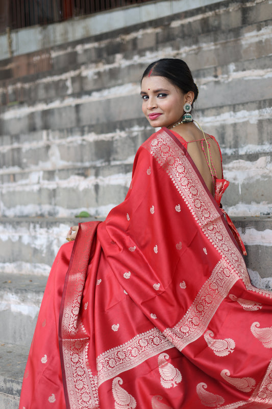 Beautiful red colour handwoven banarasi silk saree with small golden zari buti weaving.