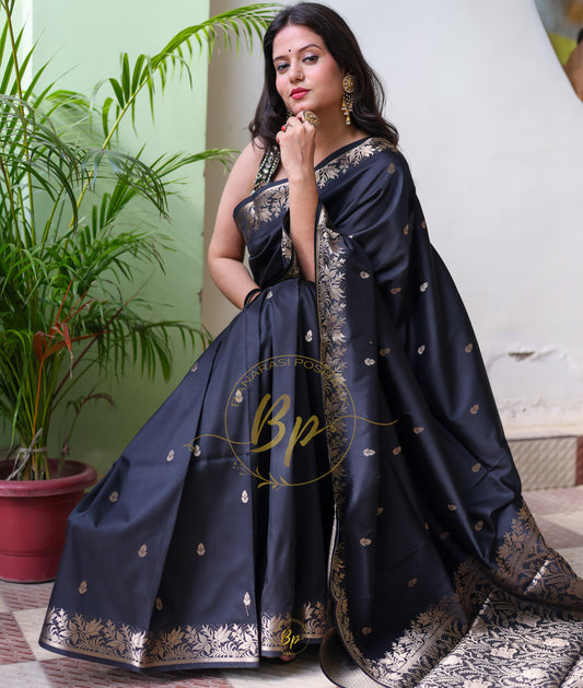 Black handwoven banarasi silk saree with copper zari border and pallu comes with small buti all over saree