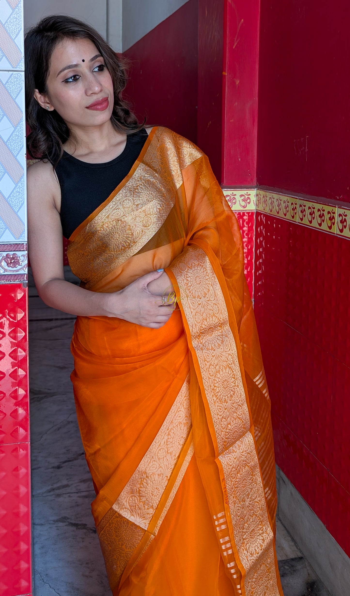 Orange handwoven banarasi organa saree with golden zari weaving