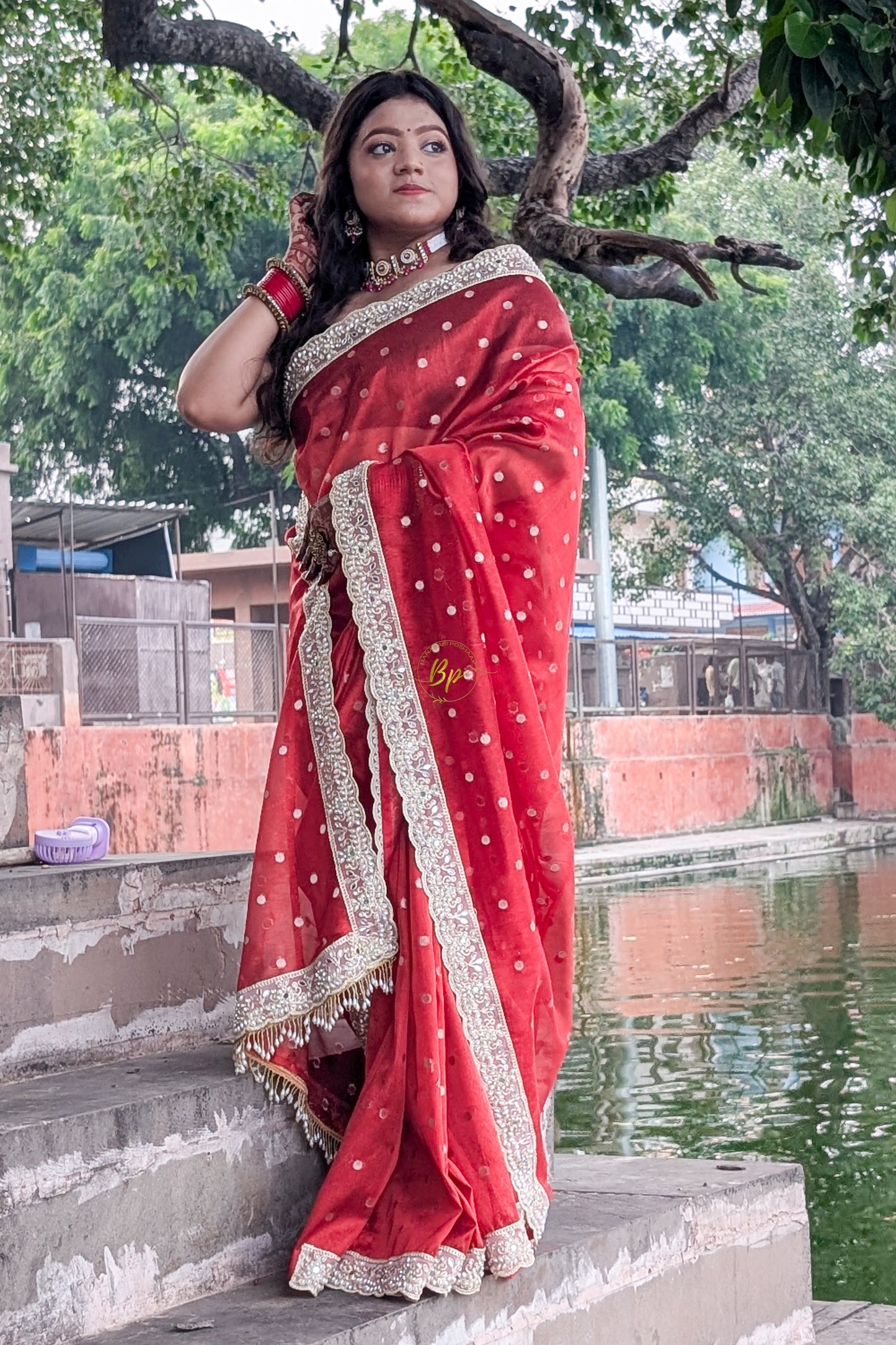 Red banarasi handwoven tissue silk saree with small zari weaving all over saree comes with beautiful pearl lace border